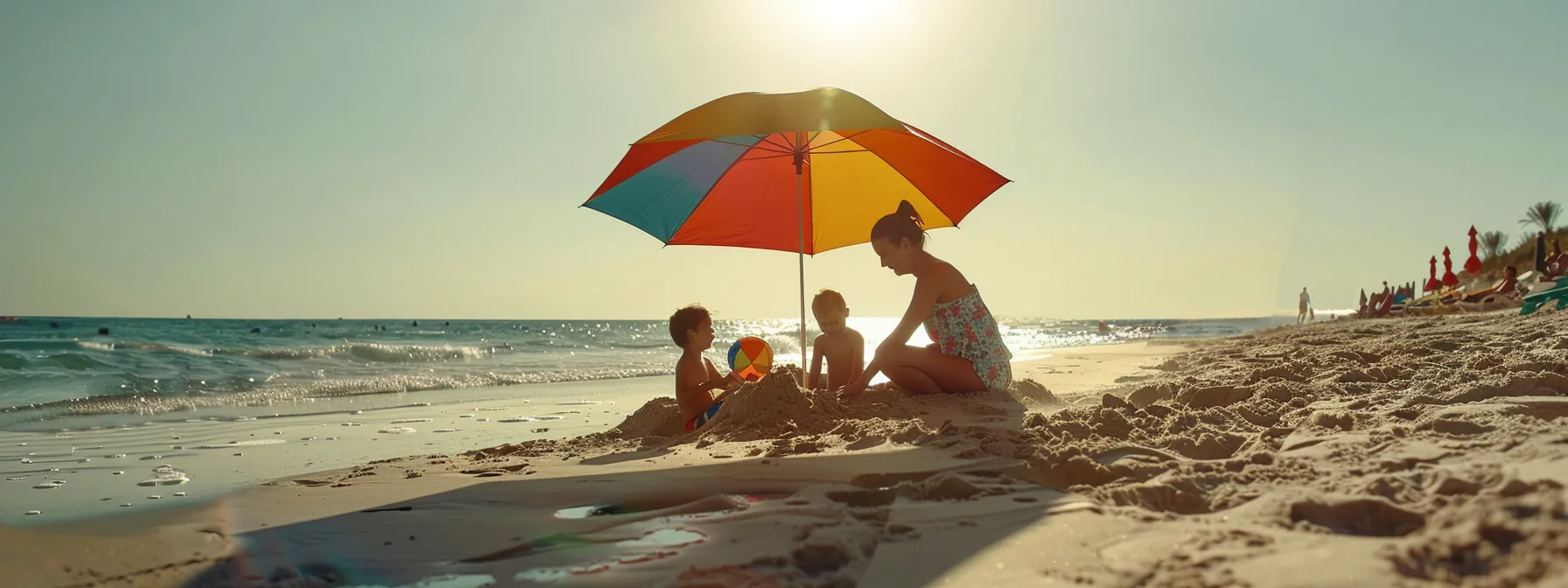 a joyful family building sandcastles under a colorful beach umbrella on a sunny shore.